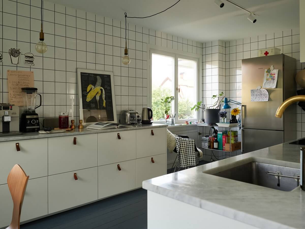 A 1940s House with Painted Floorboards in Sweden 12 white kitchen with tiles