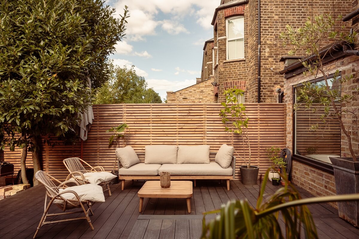 A Warm Ground Floor Apartment with Reclaimed Materials 21 wooden deck garden seating