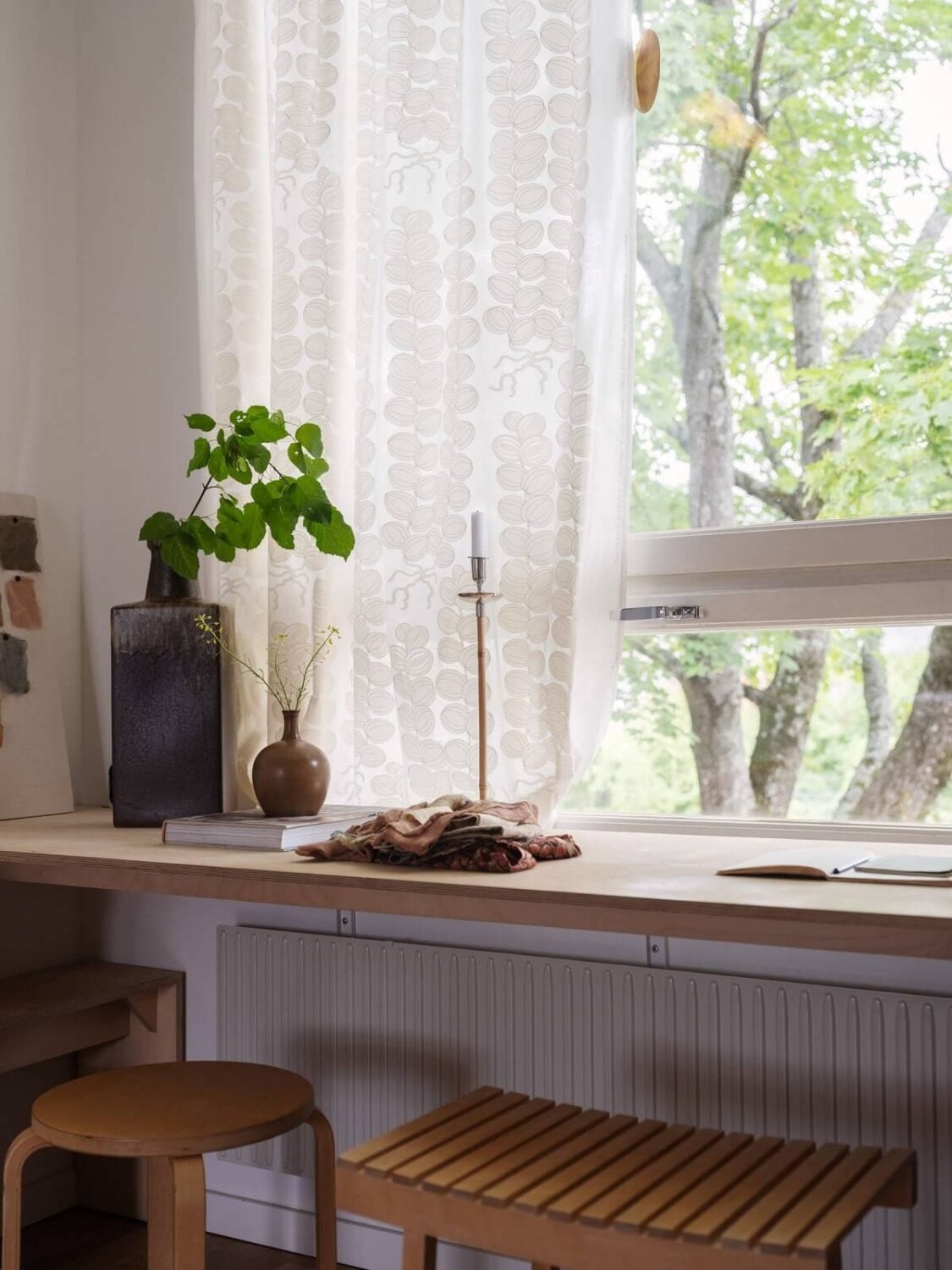 A Scandinavian Family Apartment with a Rusty Red Kitchen 16 wooden desk under window