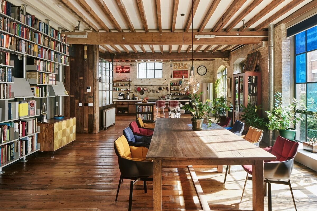 An Industrial and Colorful Warehouse Conversion in London 3 wooden dining table warehouse apartment