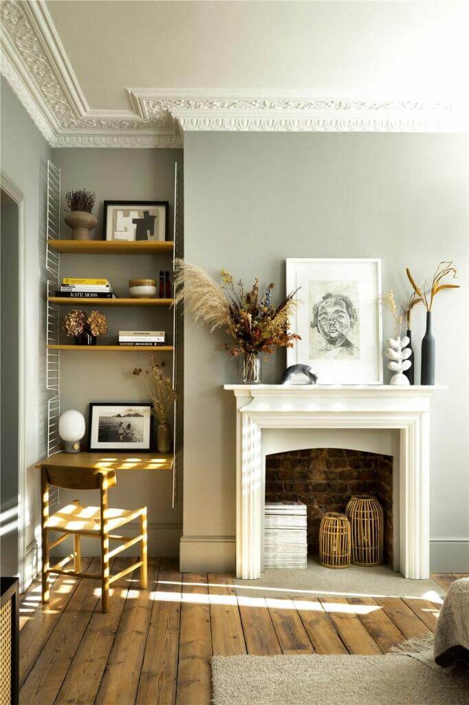 A Stylish Two Bedroom Maisonette in London 3 wooden floorboards fireplace and floating desk with shelves living room