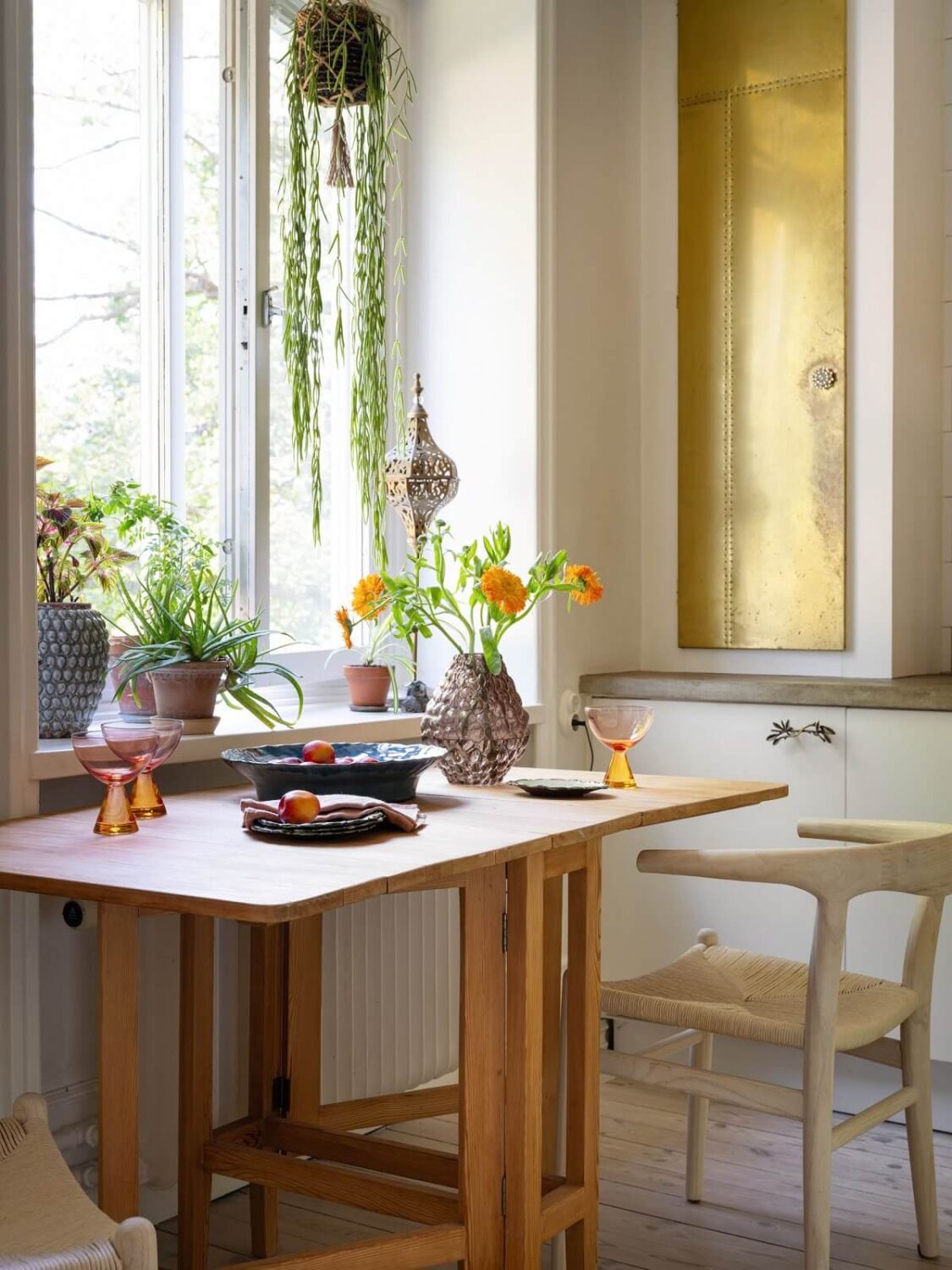 A Light and Well-Planned Apartment in Stockholm 12 wooden kitchen table