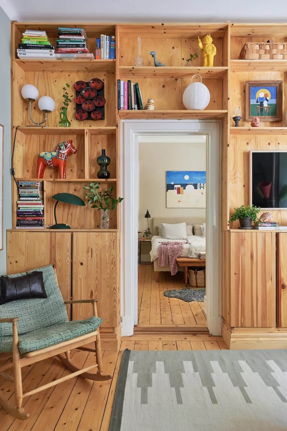 Soothing Colors and Smart Solutions in a Two Bedroom Apartment 9 wooden storage cabinet