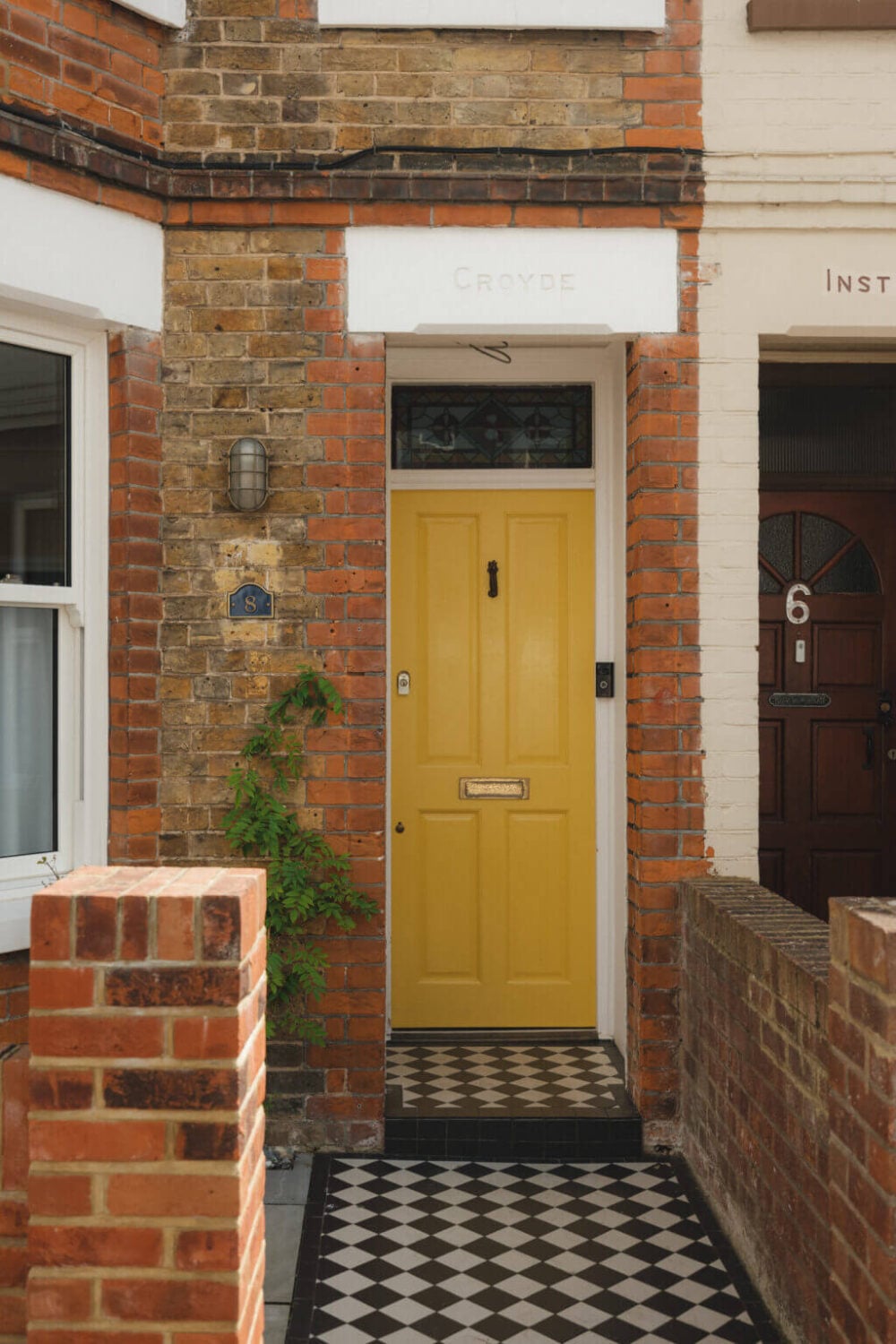 A Charming Victorian House with a Lovely Kitchen 25 yellow front door