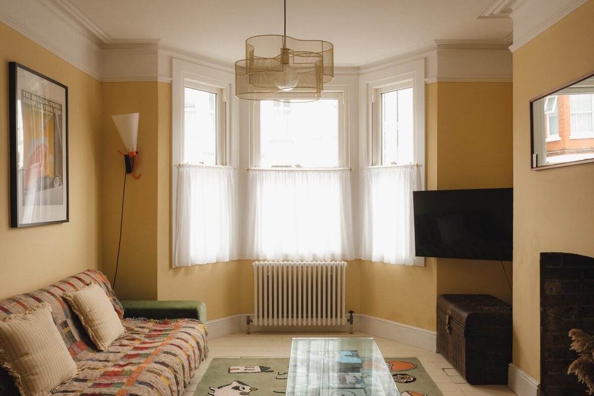 A Charming Victorian House with a Lovely Kitchen 7 yellow living room bay window