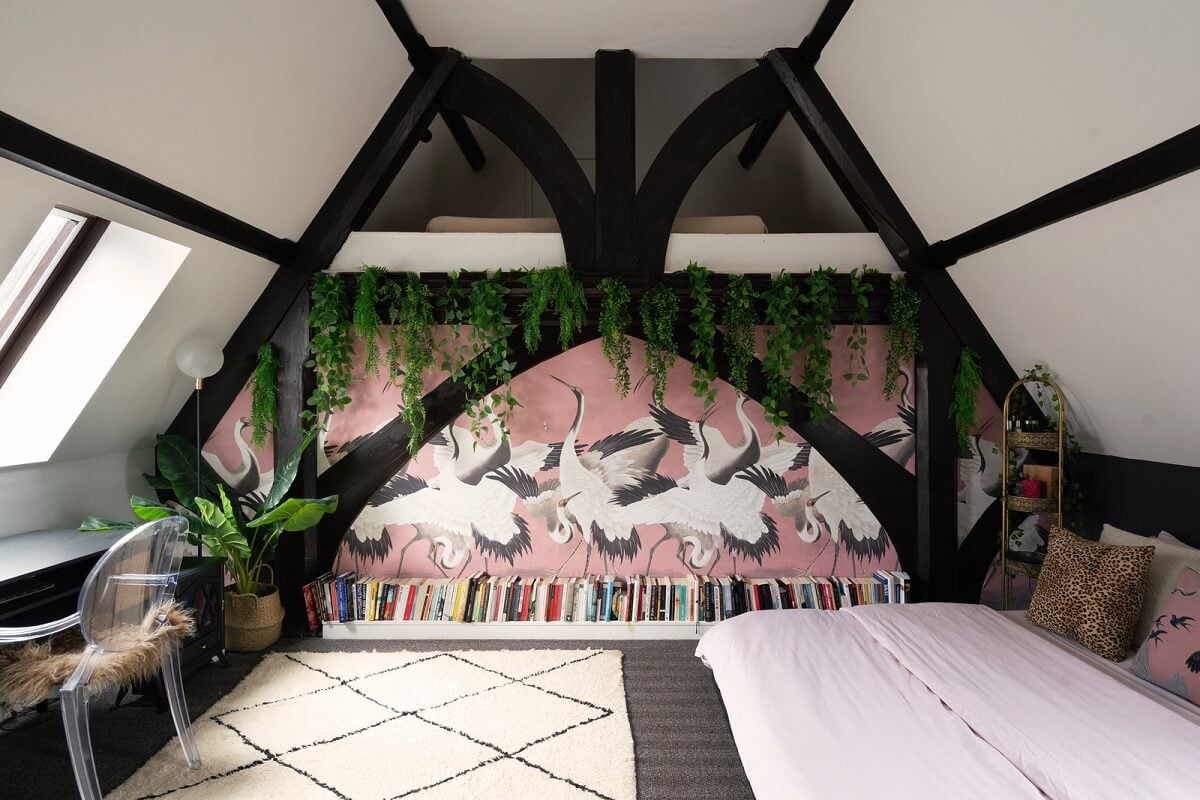 A Colorful Gothic-Style School Conversion in England 18 attic bedroom exposed beams desk A Colorful Gothic-Style School Conversion in England