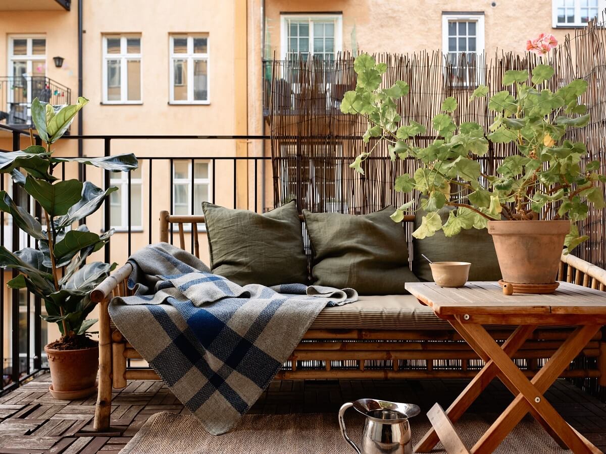 Golden Yellow Walls in a Colorful Swedish Studio Apartment 10 balcony seating bench