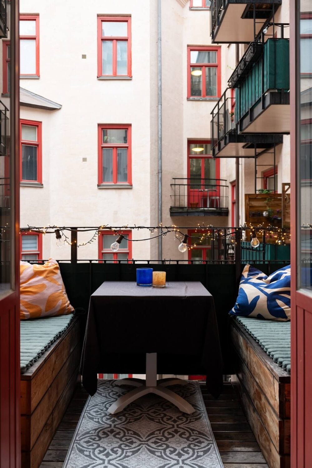 Colorful Art and Furniture in a Stylish Scandi Apartment 18 balcony with built in seating