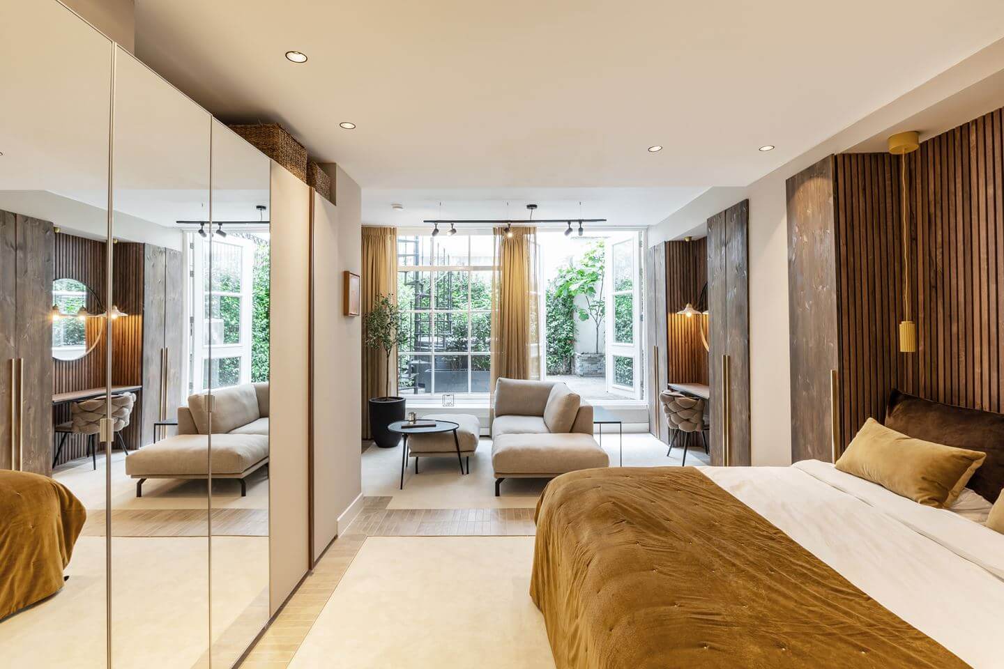 Hotel-Style Interiors in an Amsterdam Canal House 17 basement bedroom with wooden walls