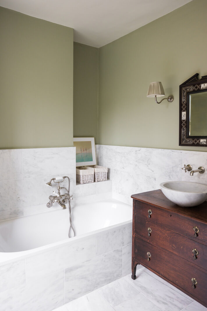 A Beautiful One-Bedroom Apartment with Plants and Period Features 15 bathroom carrara marble tiles vintage dresser sink