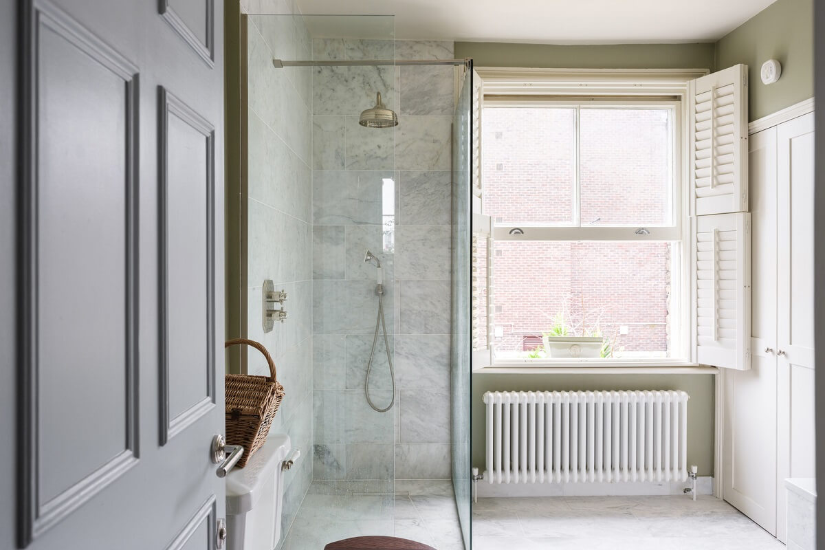A Beautiful One-Bedroom Apartment with Plants and Period Features 12 bathroom marble tiles shower