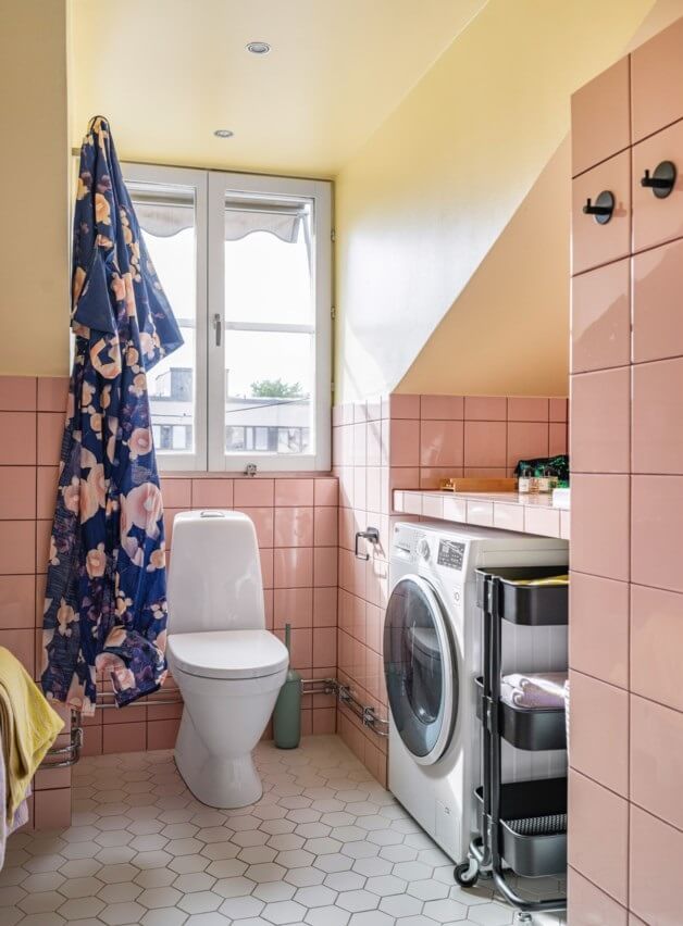 A Small, Colorful Attic Apartment with A Yellow Kitchen 24 bathroom pink tiles and yellow walls A Small, Colorful Attic Apartment with A Yellow Kitchen
