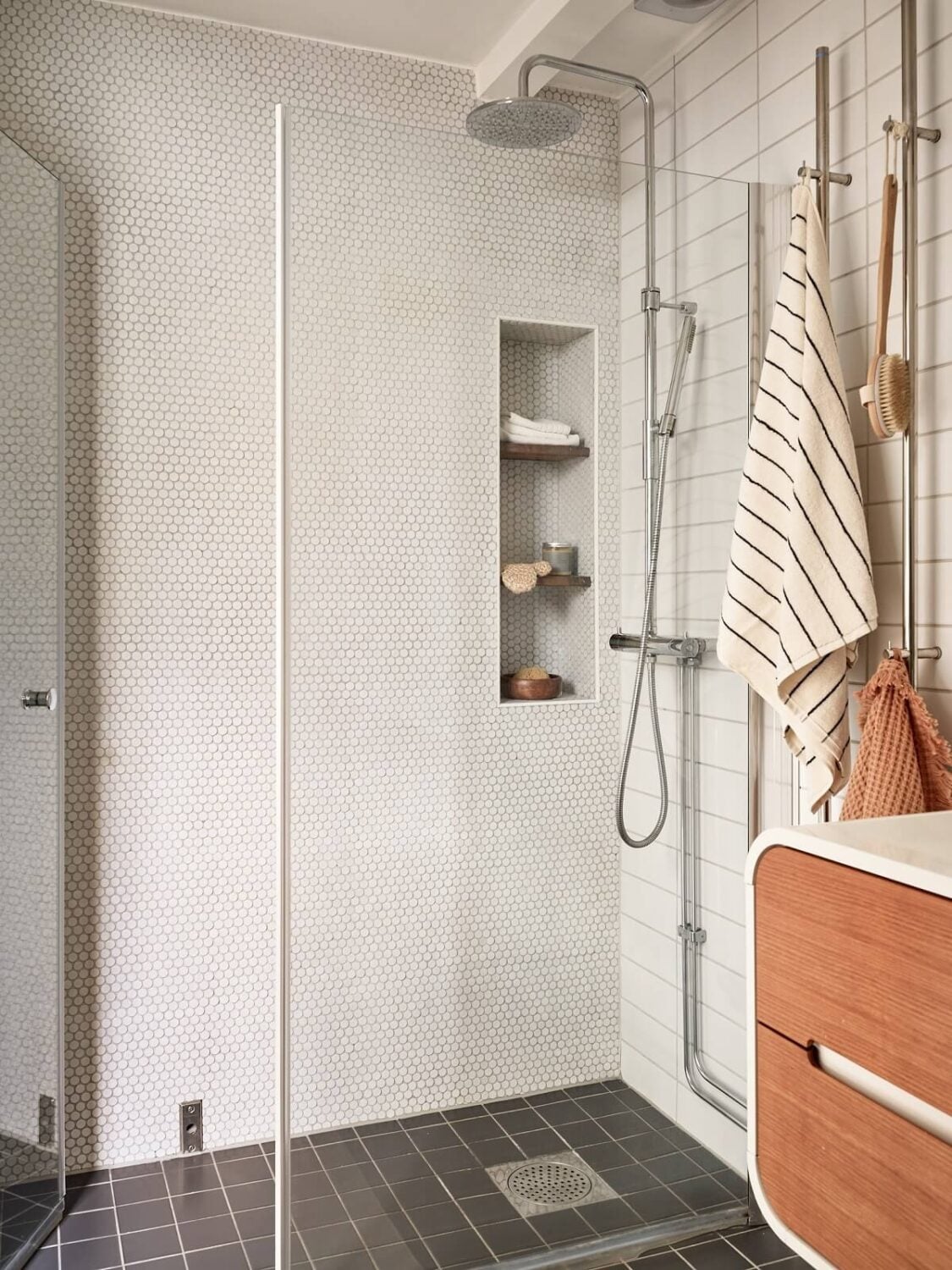 A Light Two-Bedroom Attic Apartment in Sweden 17 bathroom storage niches A Light Two-Bedroom Attic Apartment in Sweden