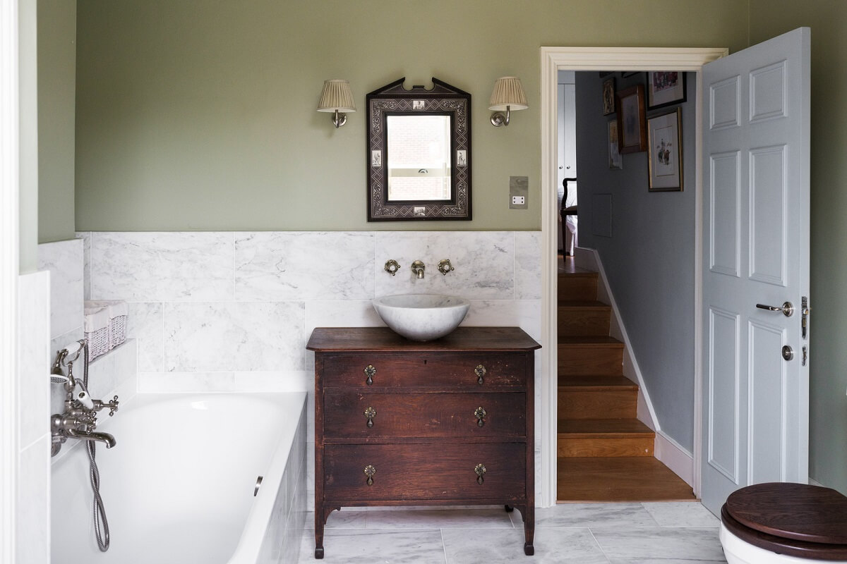 A Beautiful One-Bedroom Apartment with Plants and Period Features 14 bathroom vintage wooden dresser with sink
