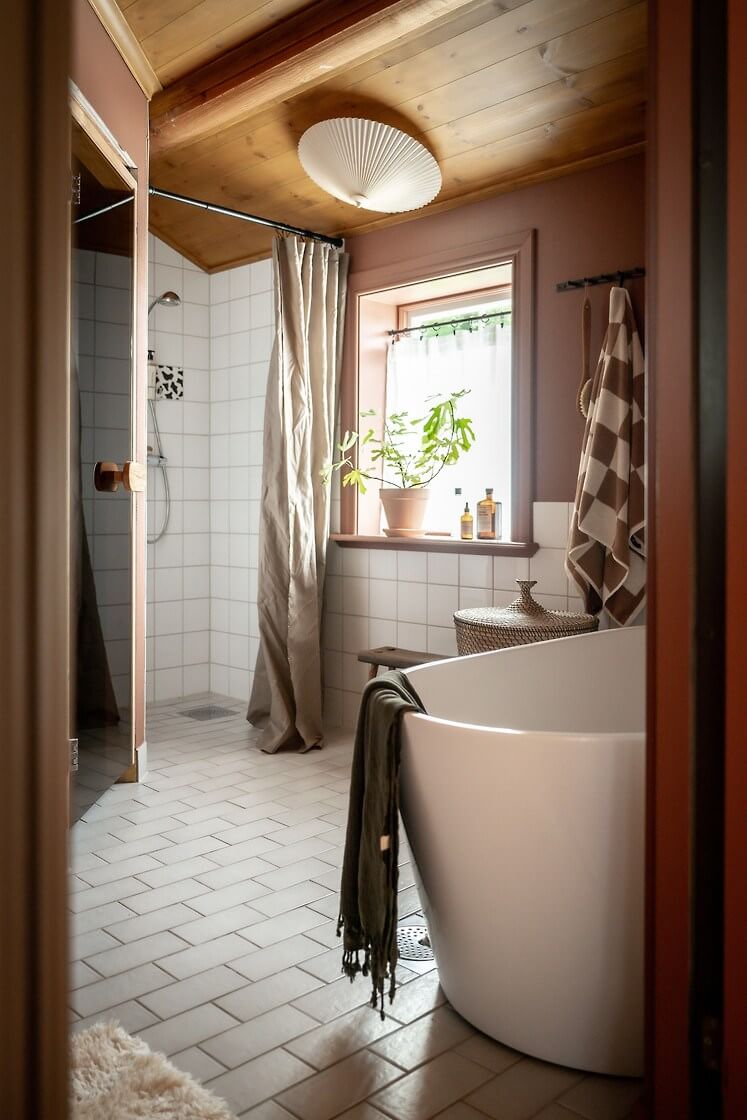 A Warm Scandinavian Log House with a Green Roof 22 bathroom with bath shower and sauna