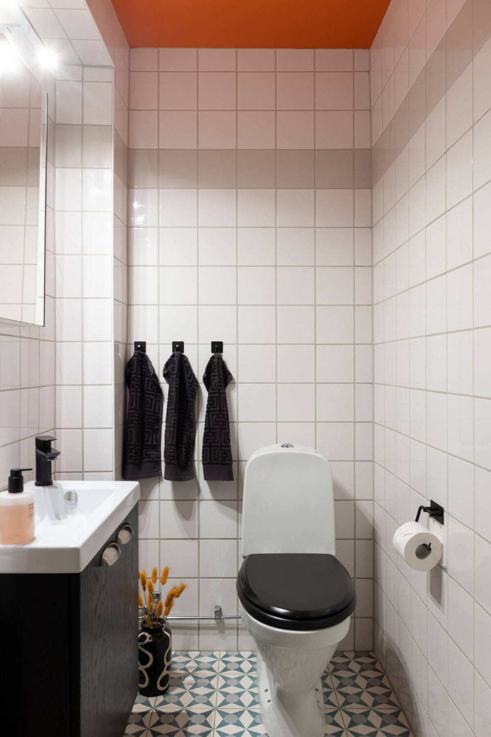 Colorful Art and Furniture in a Stylish Scandi Apartment 23 bathroom with orange ceiling Colorful Art and Furniture in a Stylish Scandi Apartment