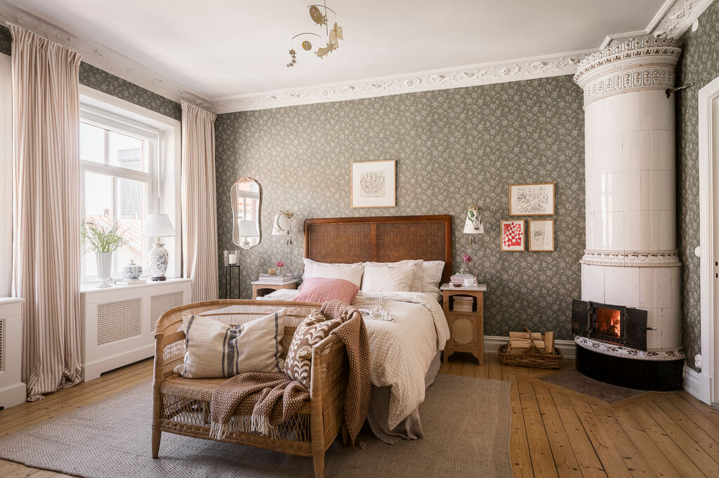 Hannes Mauritzson's Warm Yellow Hygge Apartment in Sweden 10 bedroom cane headboard Boråstapeter wallpaper