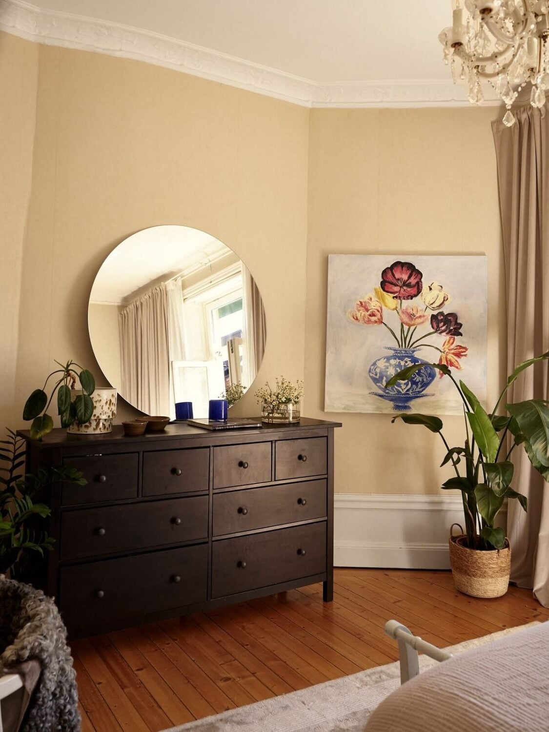 Period Features and Light Colors in a One-Bedroom Apartment 11 bedroom with beige walls and wooden floor