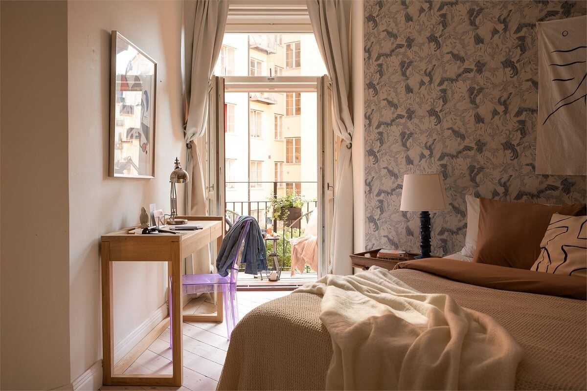 Nature-Inspired Colors in a Charming Stockholm Apartment 14 bedroom with wallpaper desk and balcony