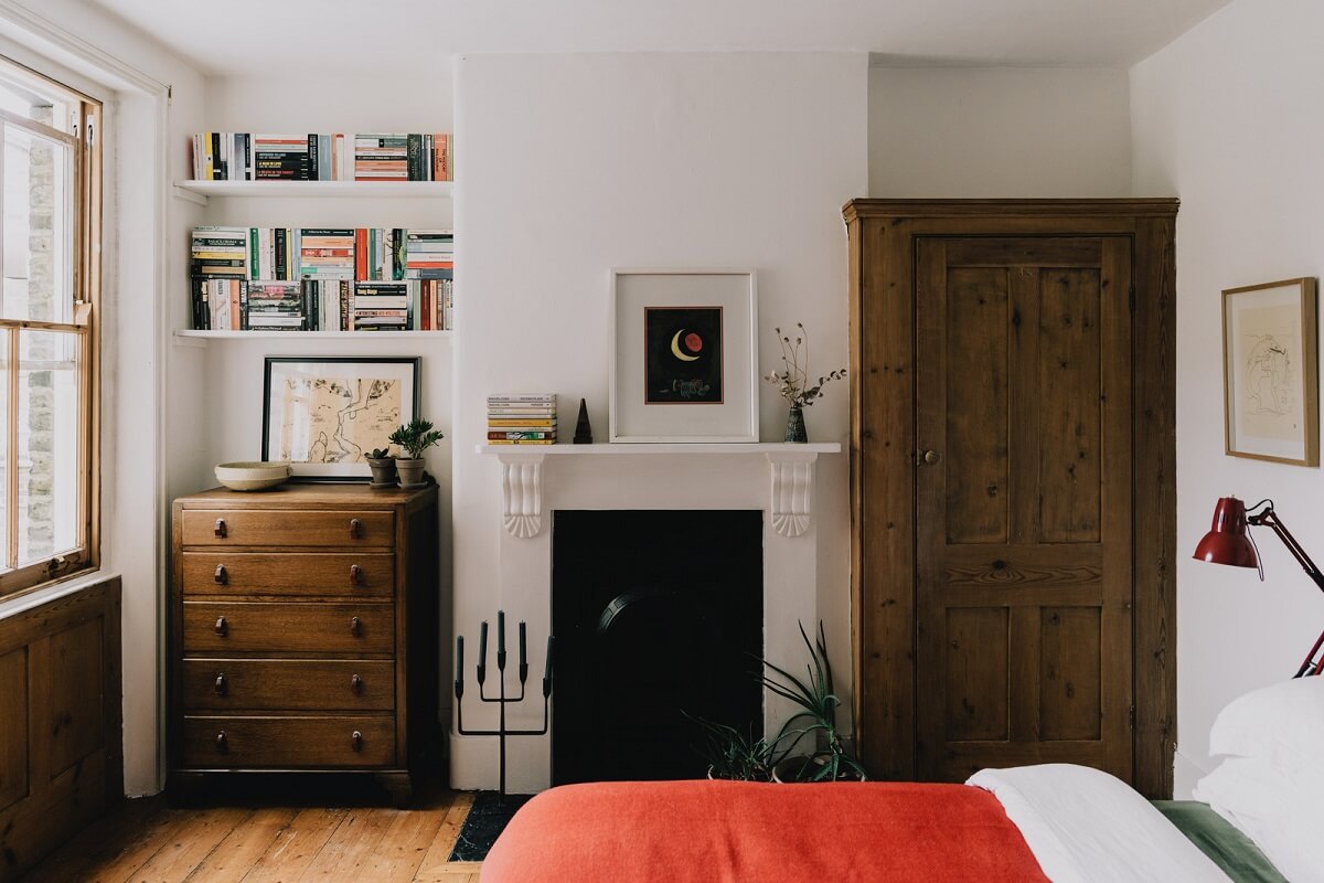 Period Details in a Cozy London Apartment in a Victorian Tenement Building 14 bedroom with wooden floorboards and fireplace