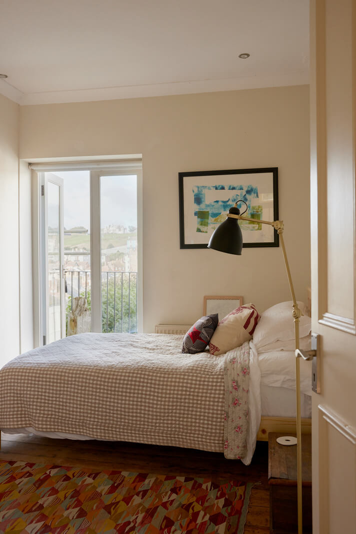 Muted Tones and an Orangery in a Victorian Coastal House 13 beige bedroom colorful rug