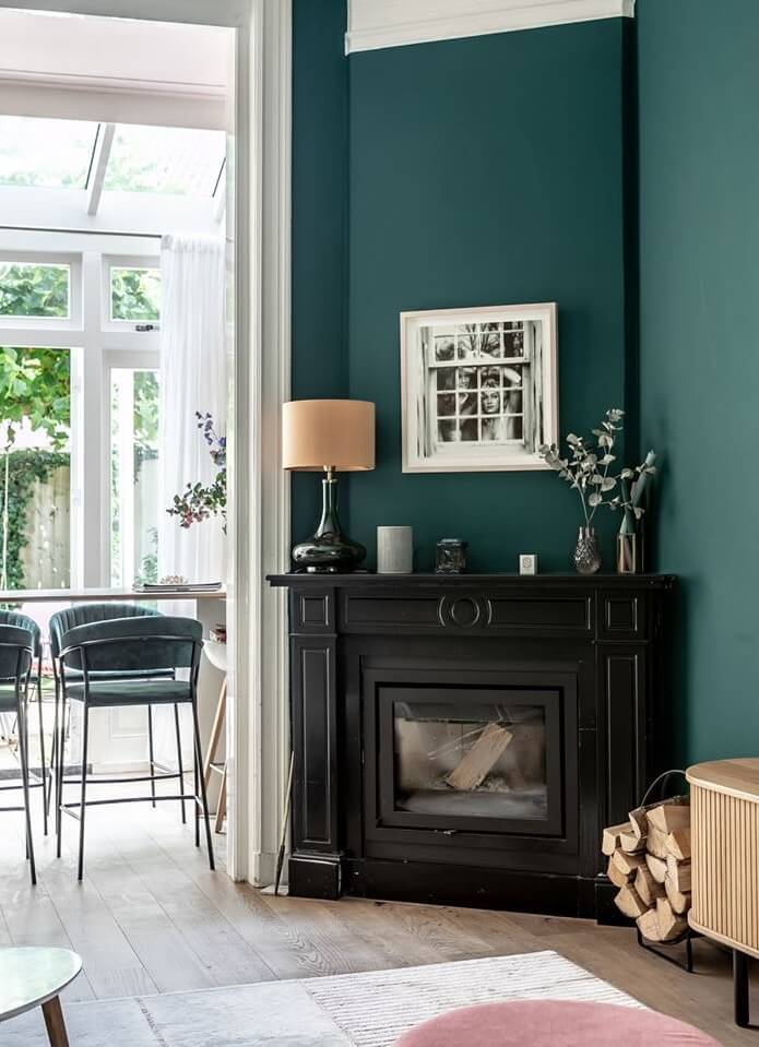 A Beautiful Monumental Villa with Green Color Accents 7 black fireplace green wall