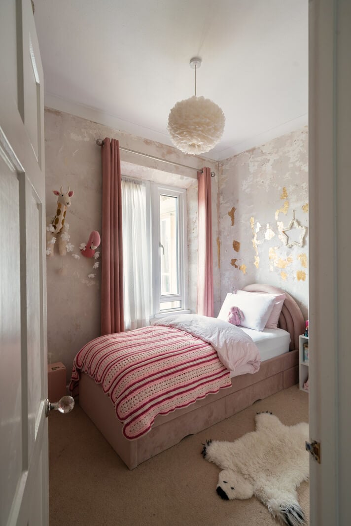 A Colorful Gothic-Style School Conversion in England 16 childs bedroom with pink color accents