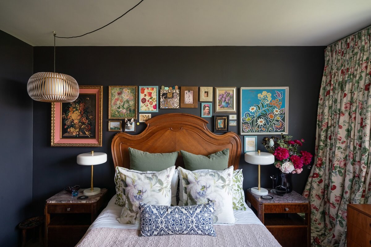 A Beautiful Mid-Century House in London 12 dark blue bedroom antique bed and gallery wall