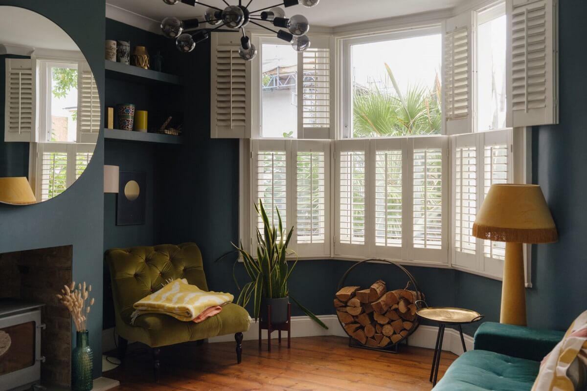 Nature-Inspired Colors in an Extended East London Home 1 dark blue living room with bay window