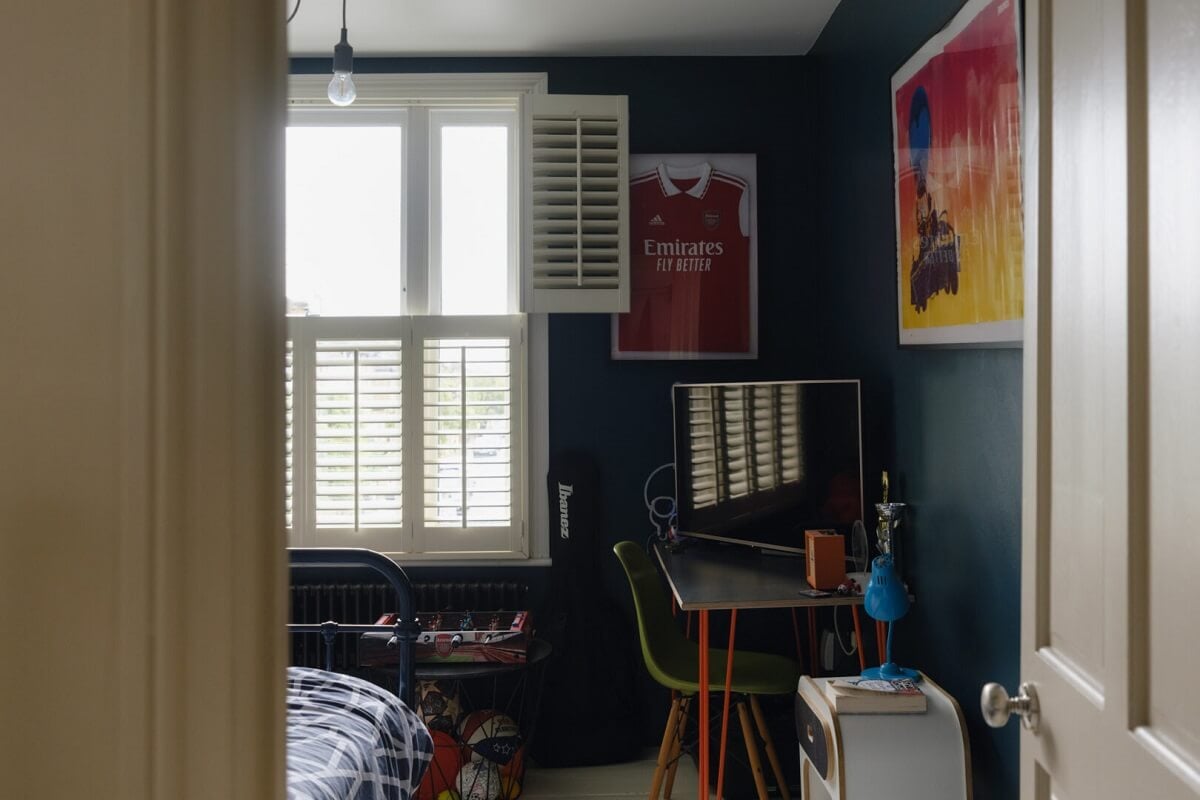 Nature-Inspired Colors in an Extended East London Home 12 datk blue walls bedroom