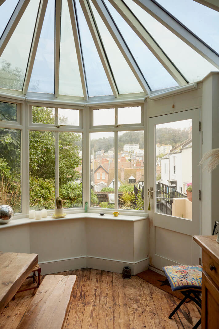 Muted Tones and an Orangery in a Victorian Coastal House 5 dining space in conservatory