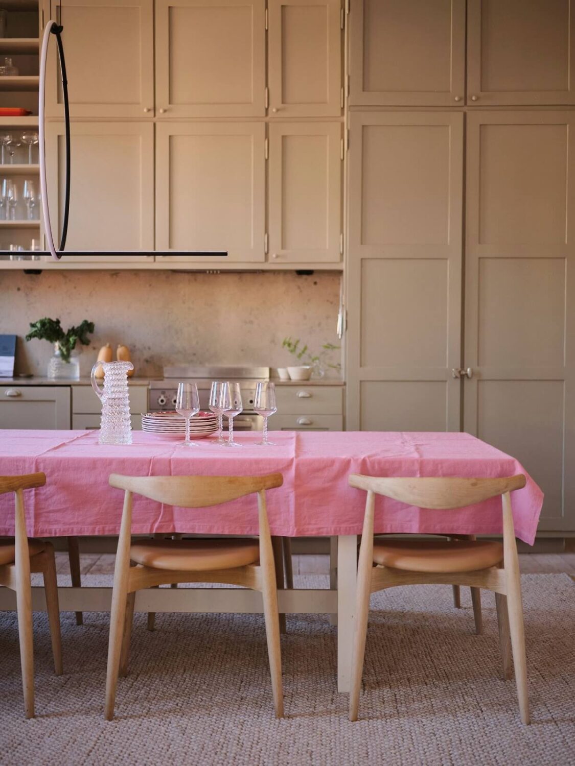 A Light Pastel Yellow and Pink Apartment in Stockholm 16 dining table scandi kitchen