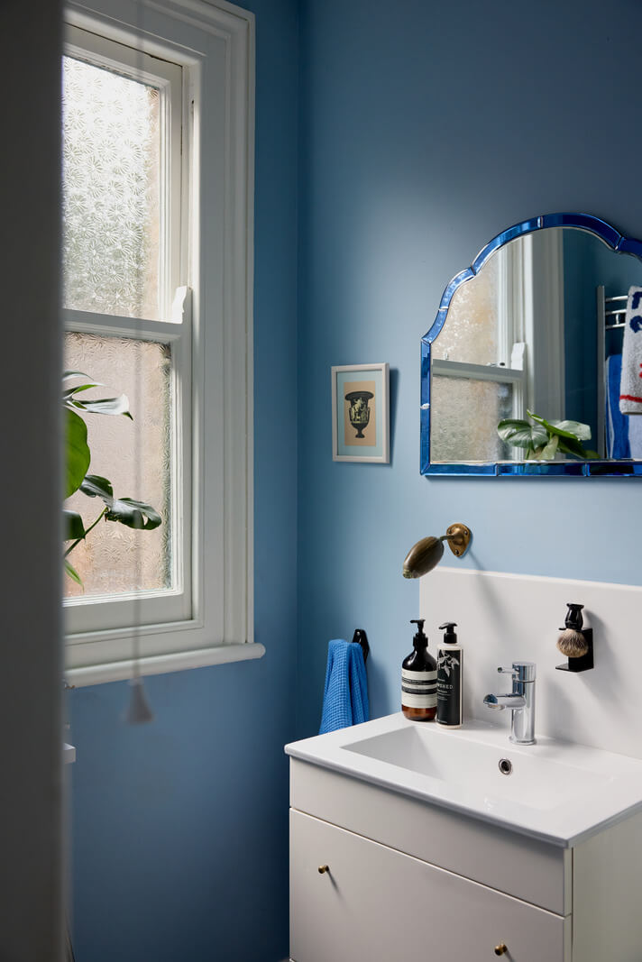 A Beautiful Color Palette in a Victorian London Apartment 15 dusty blue bathroom