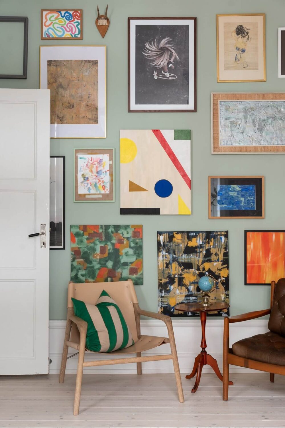 Colorful Art and Furniture in a Stylish Scandi Apartment 10 gallery wall