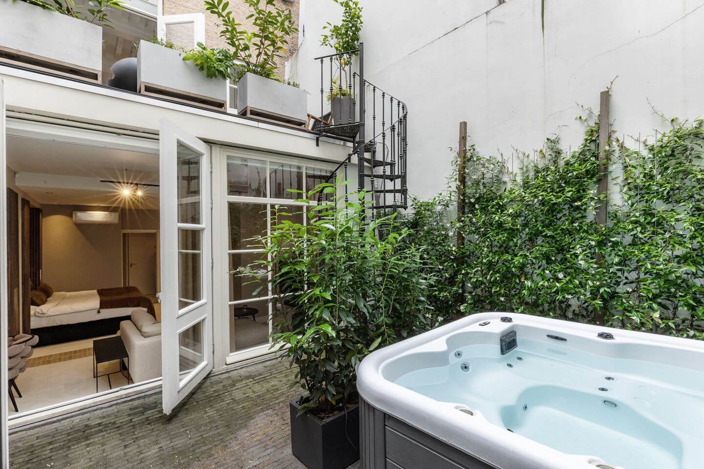 Hotel-Style Interiors in an Amsterdam Canal House 20 garden with hot tub