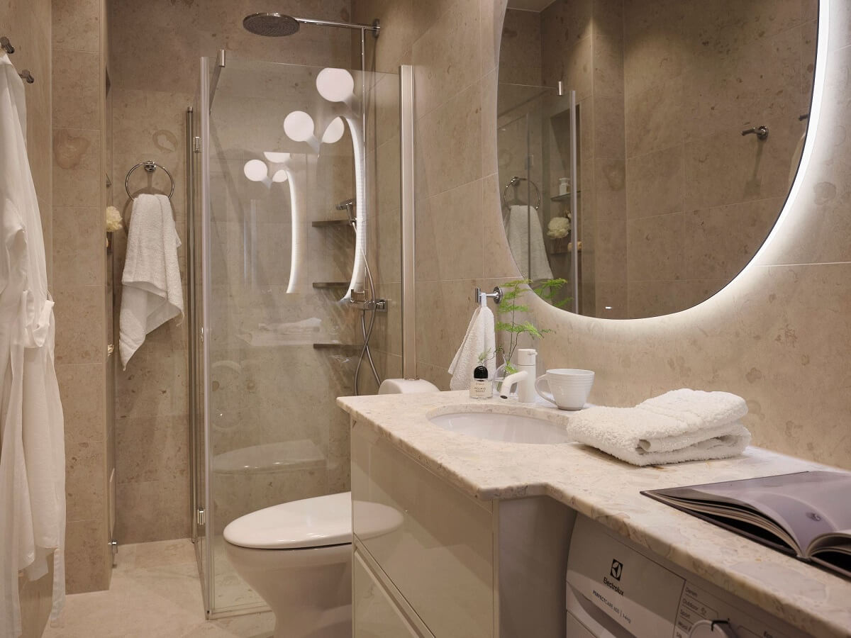 A Light Pastel Yellow and Pink Apartment in Stockholm 26 gray bathroom