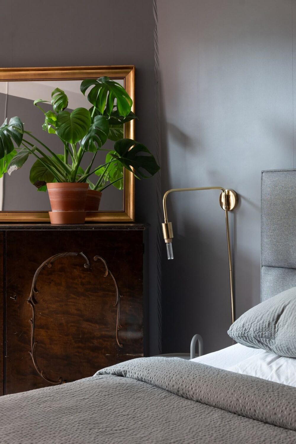 Colorful Art and Furniture in a Stylish Scandi Apartment 19 gray bedroom detail