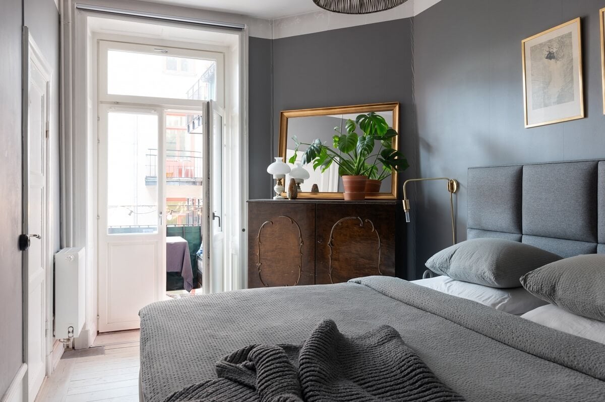 Colorful Art and Furniture in a Stylish Scandi Apartment 17 gray bedroom with balcony