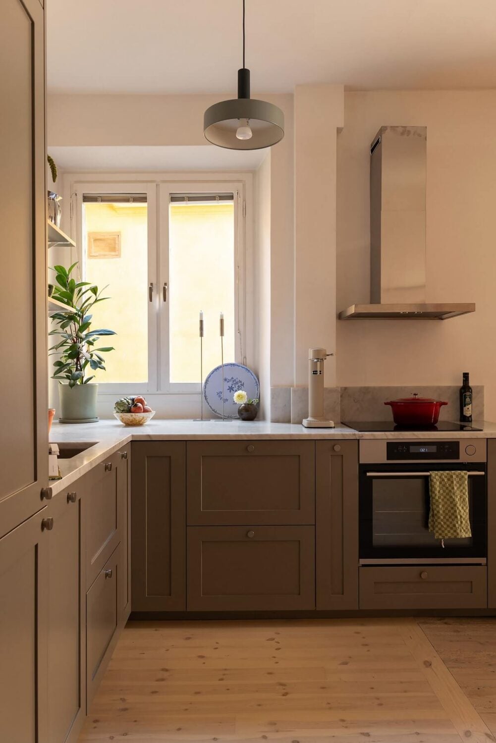 Sober Colors in a Small Renovated Stockholm Apartment 11 gray kitchen cabinets