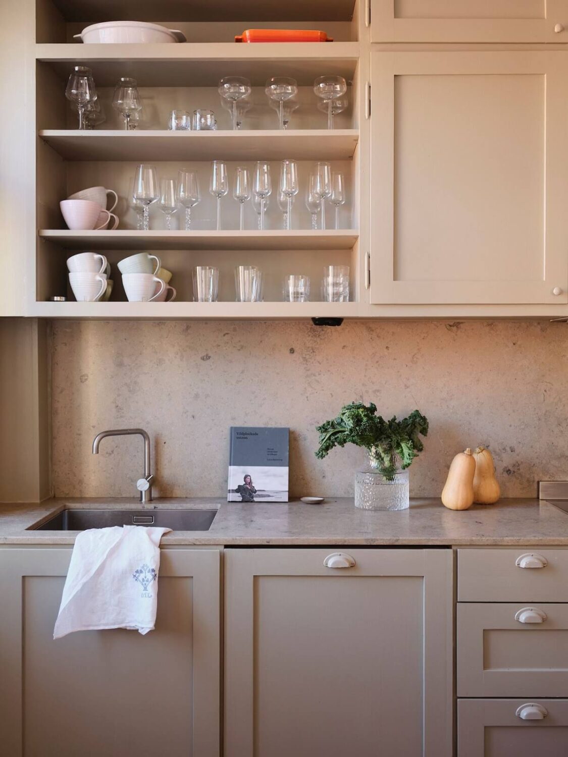 A Light Pastel Yellow and Pink Apartment in Stockholm 15 gray kitchen detail