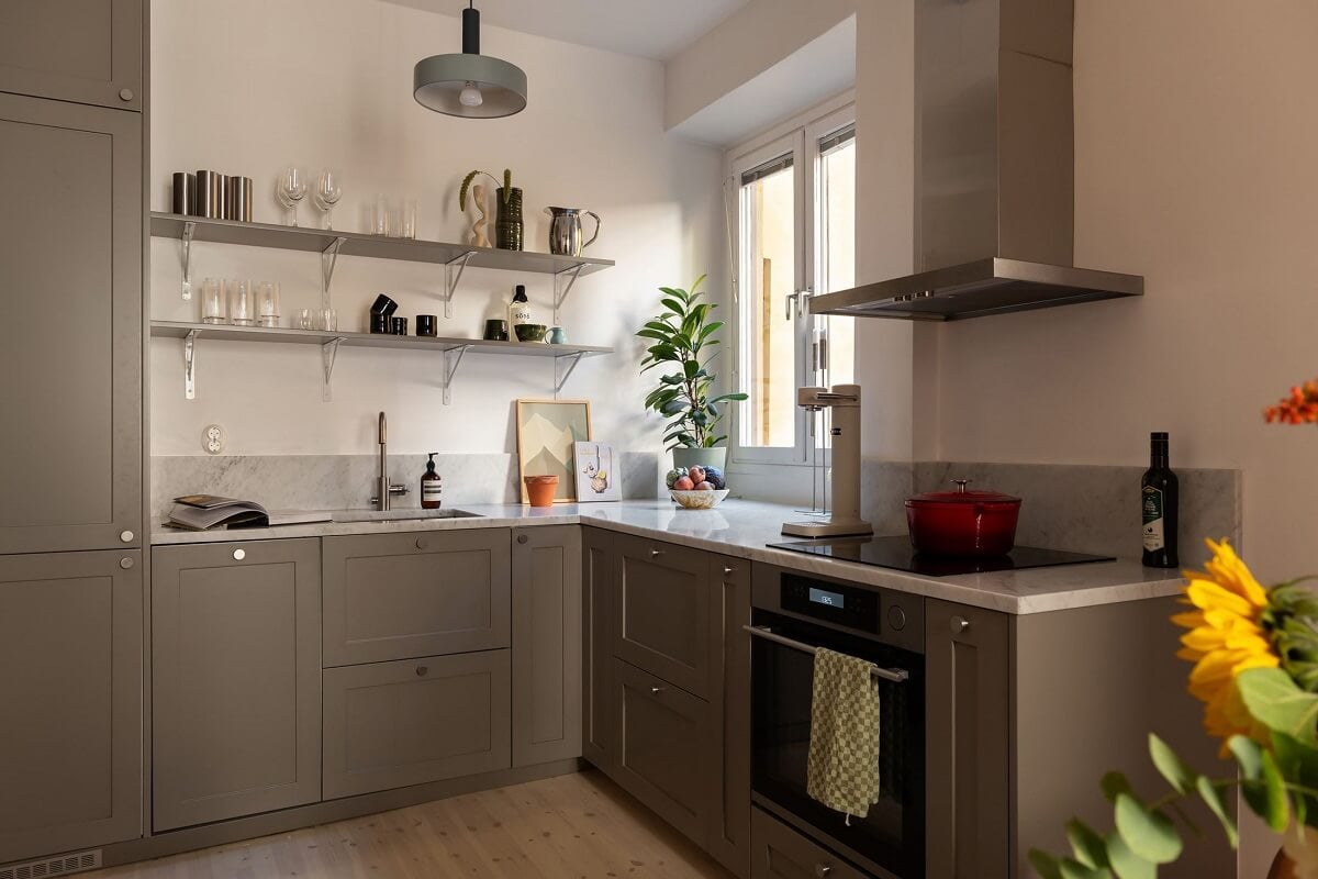 Sober Colors in a Small Renovated Stockholm Apartment 8 gray kitchen with shelves