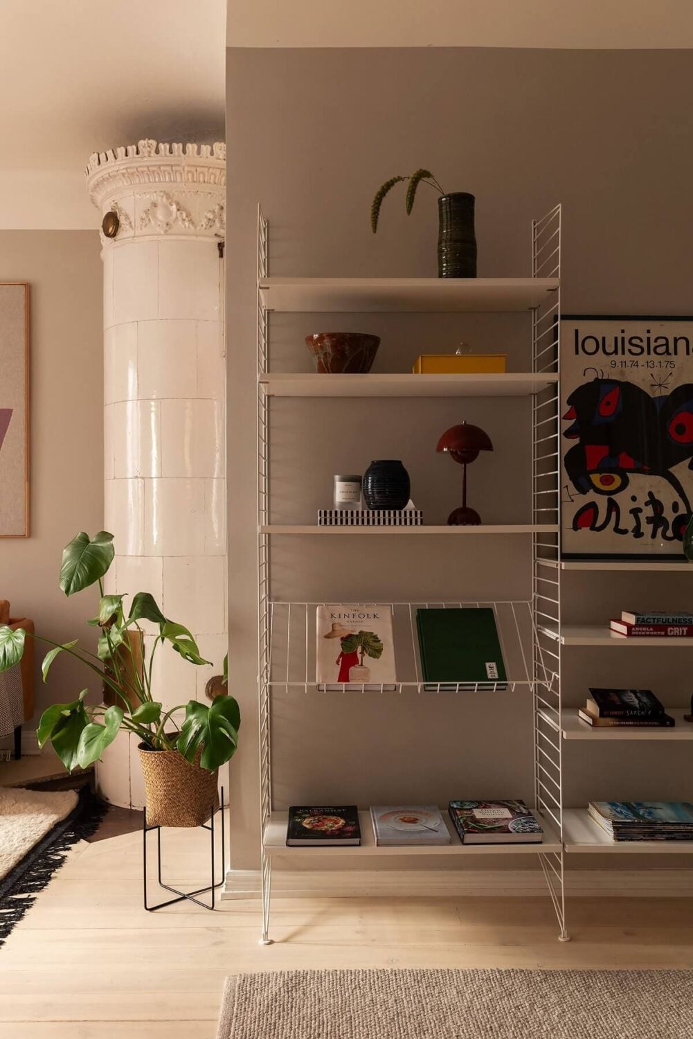 Sober Colors in a Small Renovated Stockholm Apartment 6 gray living room shelves