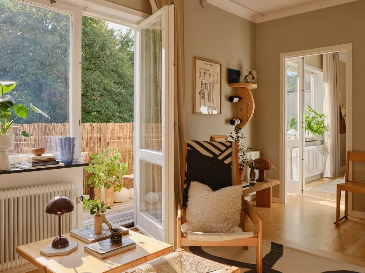 A Beautiful Calm and Natural Apartment with a Green Kitchen 15 gray scandi living room with balcony