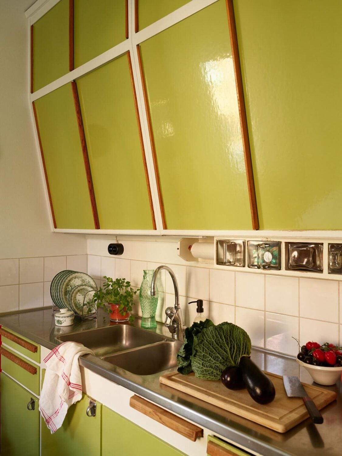 Preserved Midcentury Details and a Red Bedroom in a Stockholm Apartment 11 green midcentury kitchen cabinets nordroom