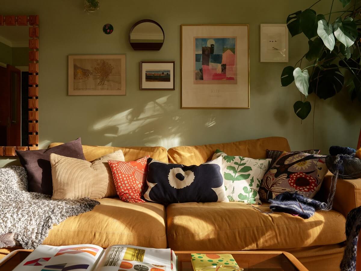 Preserved Midcentury Details and a Red Bedroom in a Stockholm Apartment 2 green walls ochre sofa