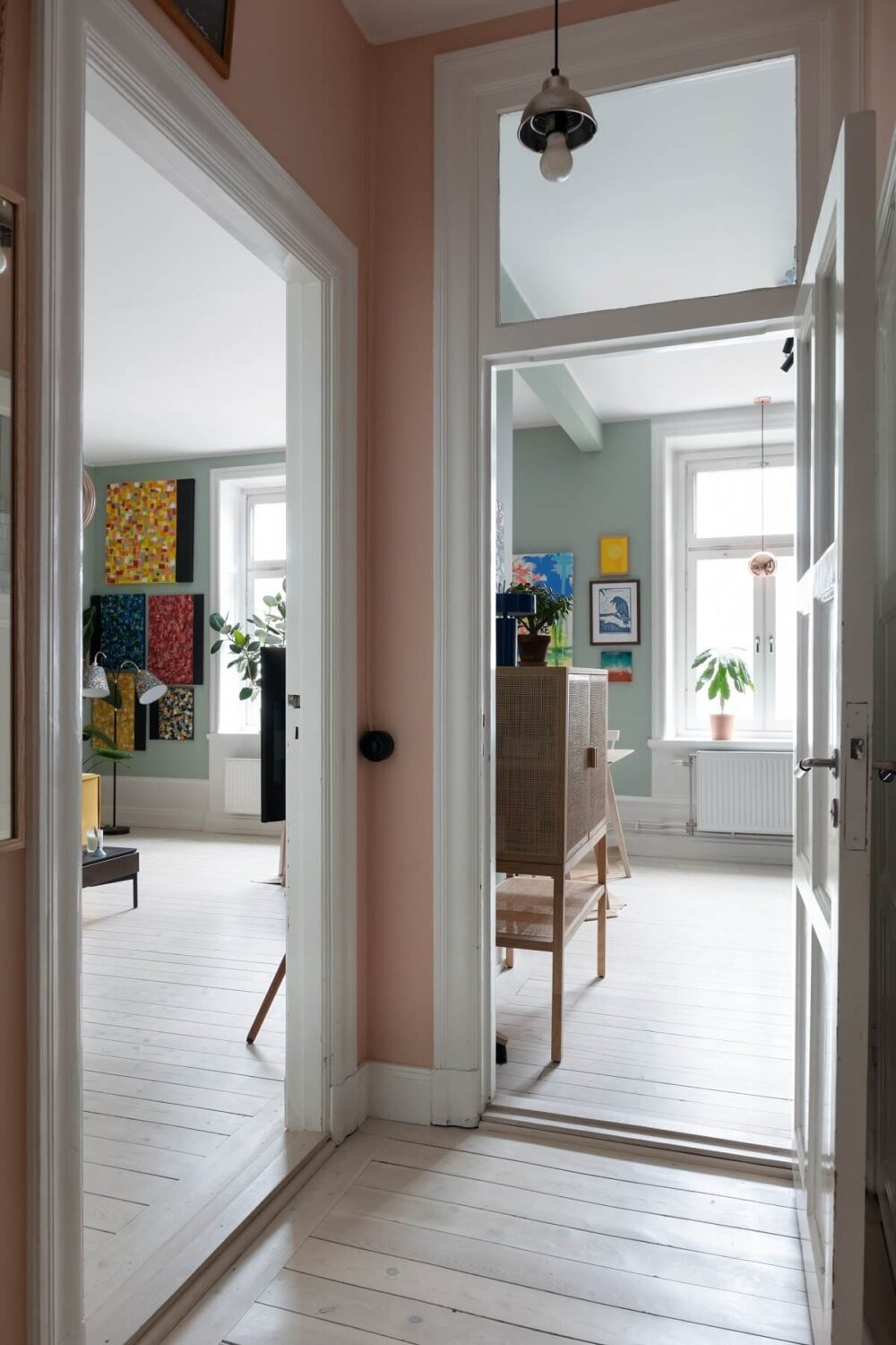 Colorful Art and Furniture in a Stylish Scandi Apartment 22 hall wooden floor