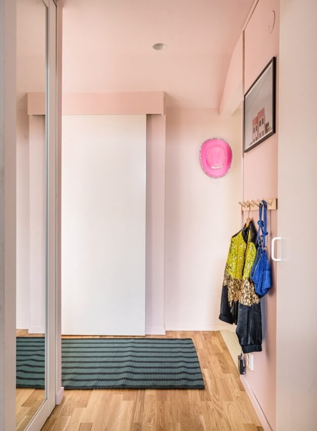 A Small, Colorful Attic Apartment with A Yellow Kitchen 26 hallway