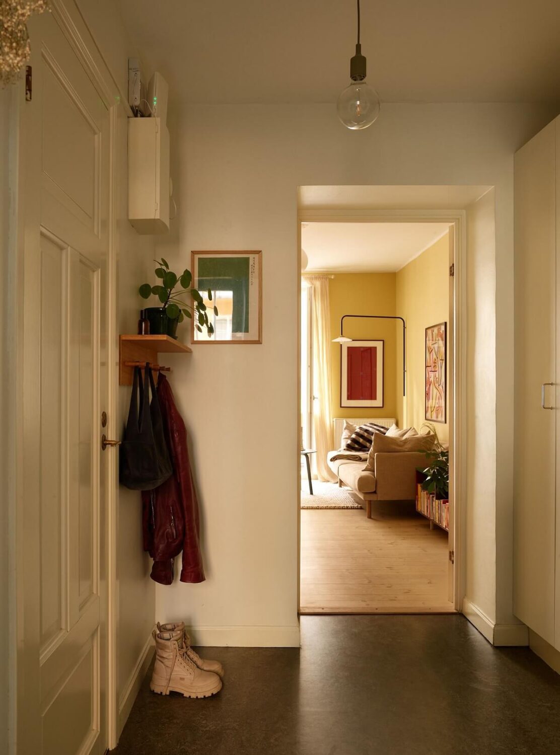 Golden Yellow Walls in a Colorful Swedish Studio Apartment 17 hallway