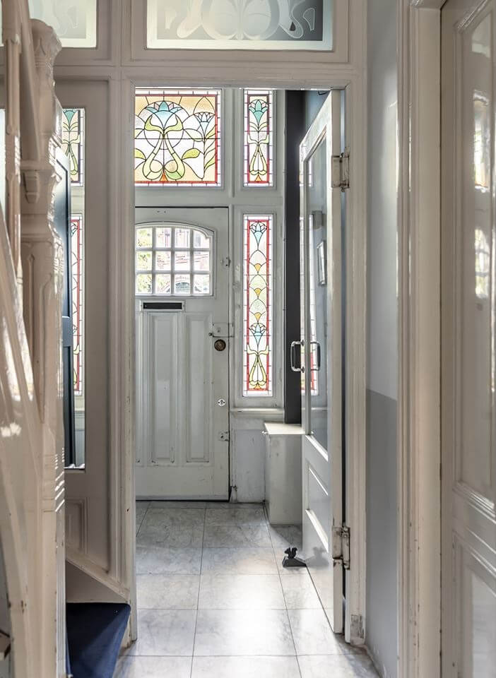 A Beautiful Monumental Villa with Green Color Accents 15 hallway stained glass