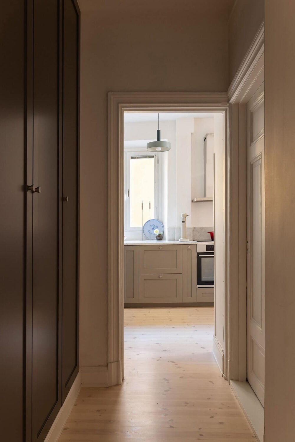 Sober Colors in a Small Renovated Stockholm Apartment 13 hallway with built in cabinets